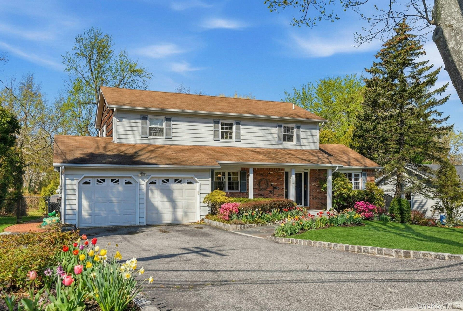35 East Neck Road Huntington, NY 11743 - Photo 3 of 41 front view of a house with a yard