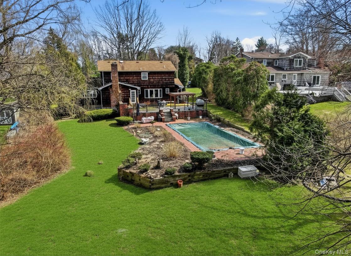 35 East Neck Road Huntington, NY 11743 - Photo 31 of 41 a front view of a house with garden