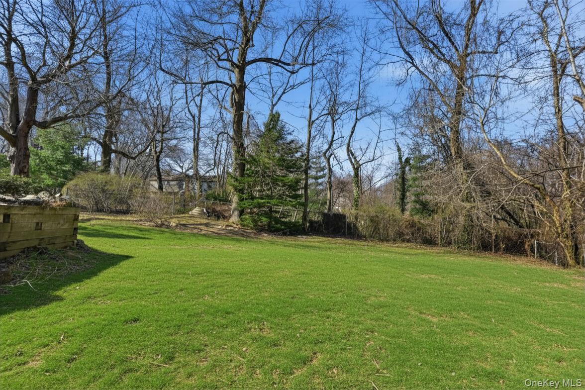 35 East Neck Road Huntington, NY 11743 - Photo 34 of 41 a backyard of a house with lots of green space