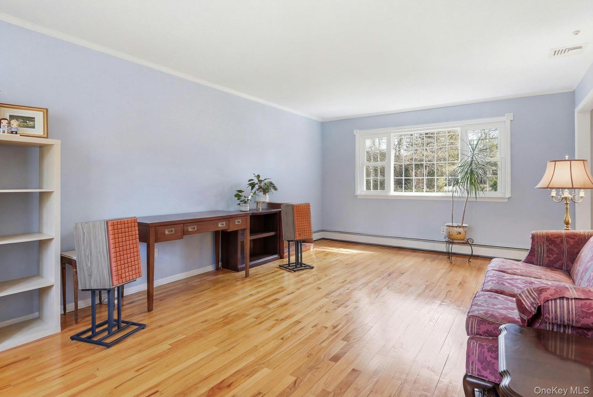 35 East Neck Road Huntington, NY 11743 - Photo 8 of 41 a living room with furniture and a wooden floor