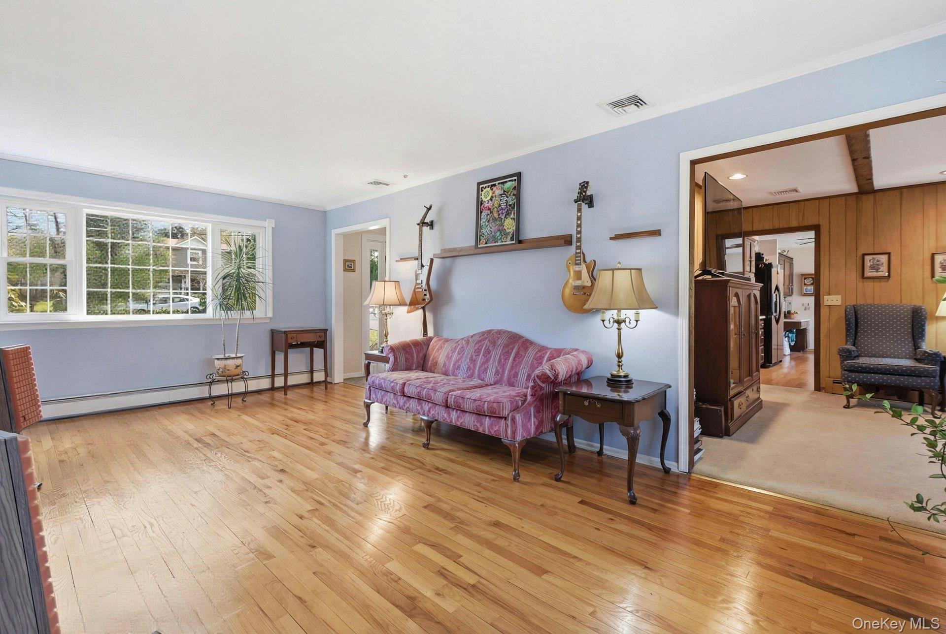35 East Neck Road Huntington, NY 11743 - Photo 9 of 41 a living room with furniture and wooden floor
