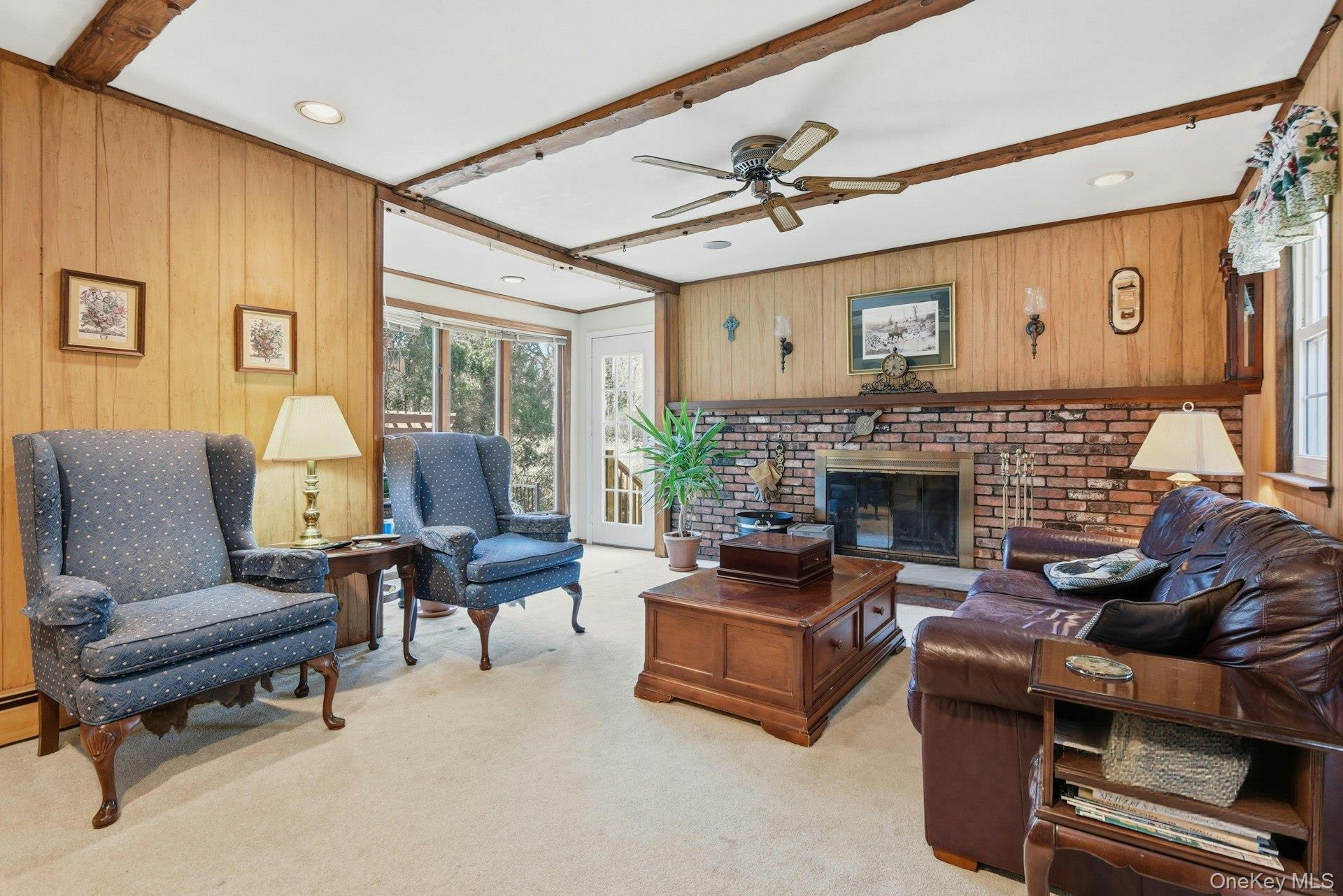 35 East Neck Road Huntington, NY 11743 - Photo 10 of 41 a living room with furniture and a fireplace