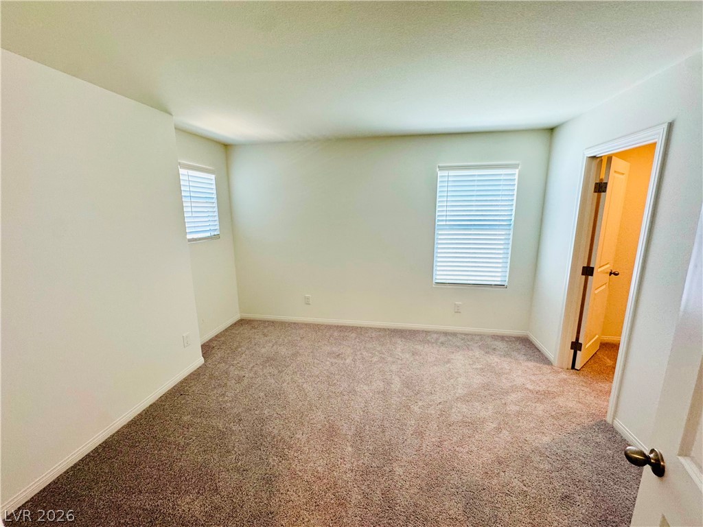 9249 Innot Avenue Las Vegas, NV 89148 - Photo 20 of 24 A quiet, carpeted room awaits personalization.