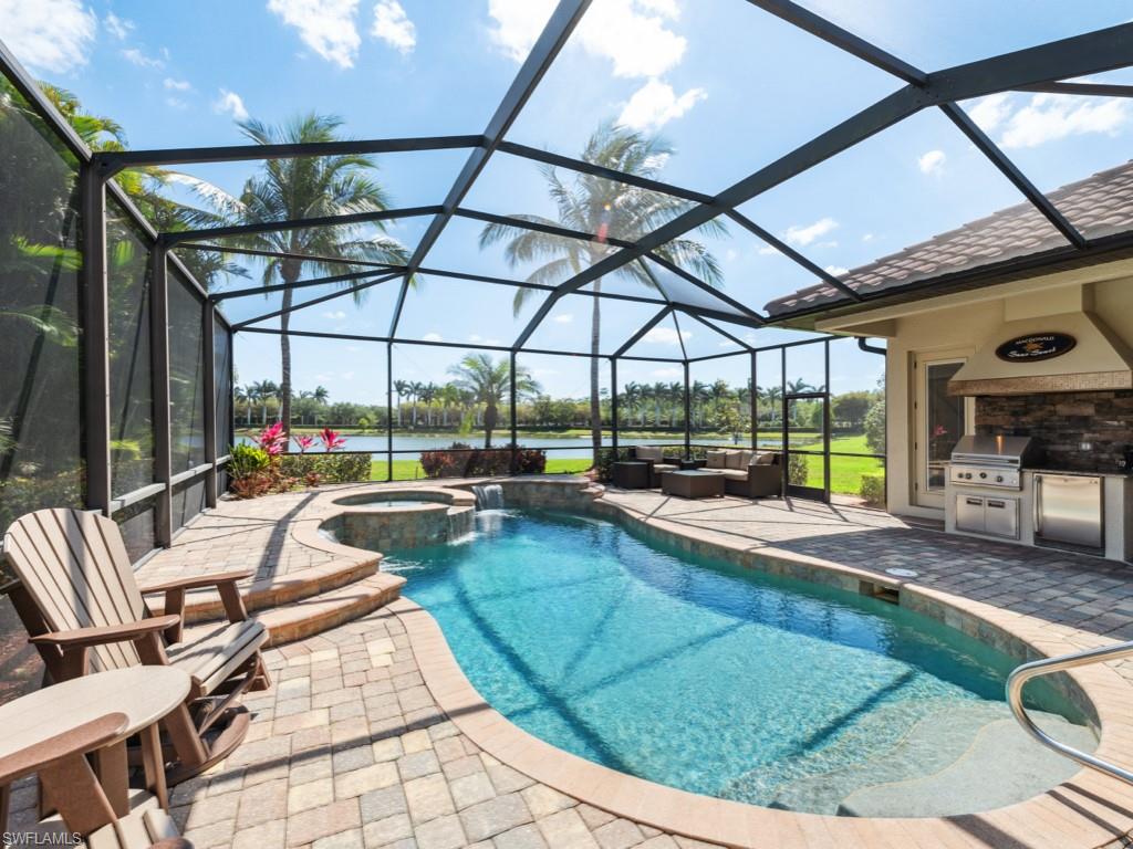 9430 Italia Way Naples, FL 34113 - Photo 27 of 47 View of pool featuring a patio, a grill, outdoor lounge area, area for grilling, and glass enclosure