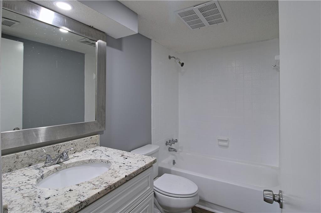 122 Rue Fontaine Lithonia, GA 30038 - Photo 15 of 36 a bathroom with a sink a toilet and bathtub
