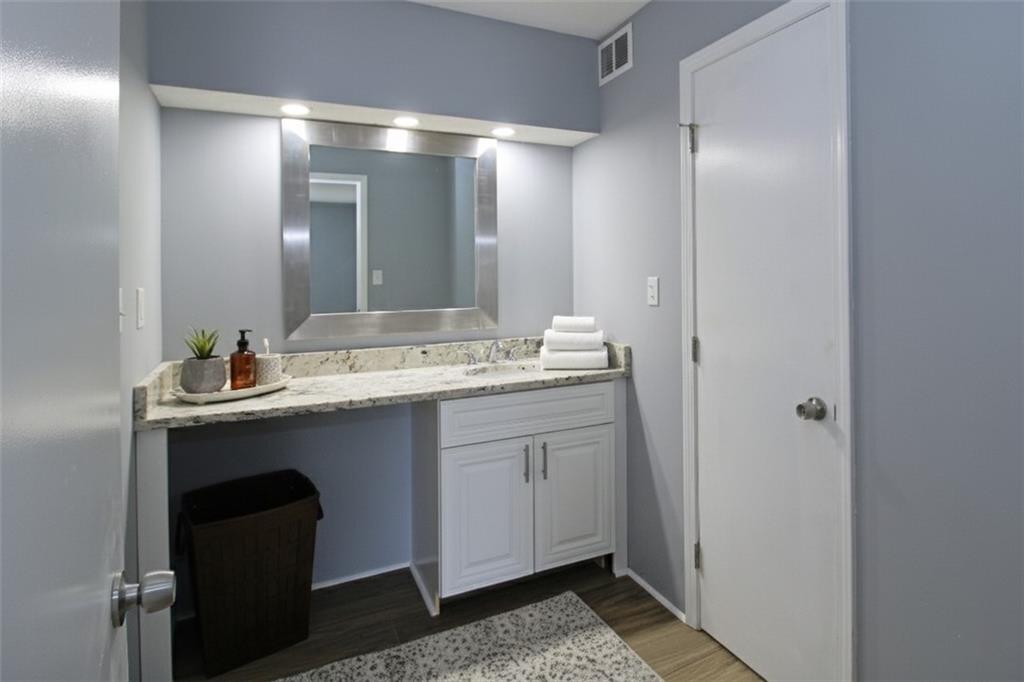 122 Rue Fontaine Lithonia, GA 30038 - Photo 21 of 36 a bathroom with a sink and a mirror