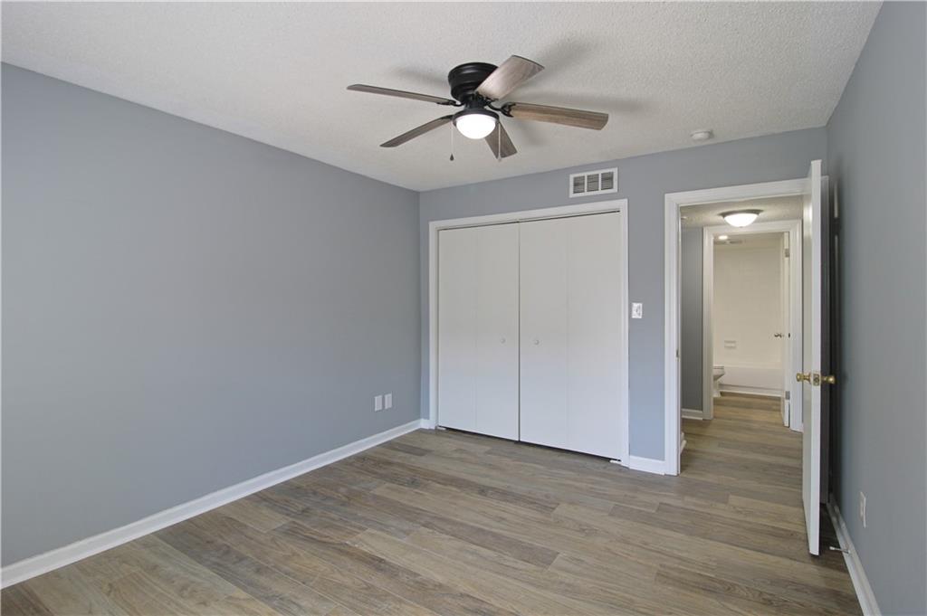122 Rue Fontaine Lithonia, GA 30038 - Photo 30 of 36 wooden floor in an empty room
