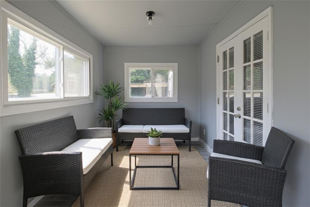122 Rue Fontaine Lithonia, GA 30038 - Photo 34 of 36 a living room with furniture a rug and a window