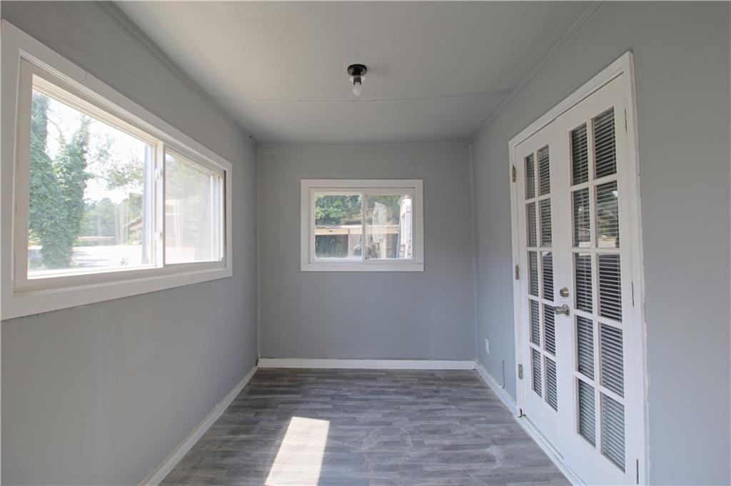 122 Rue Fontaine Lithonia, GA 30038 - Photo 35 of 36 a view of empty room with windows