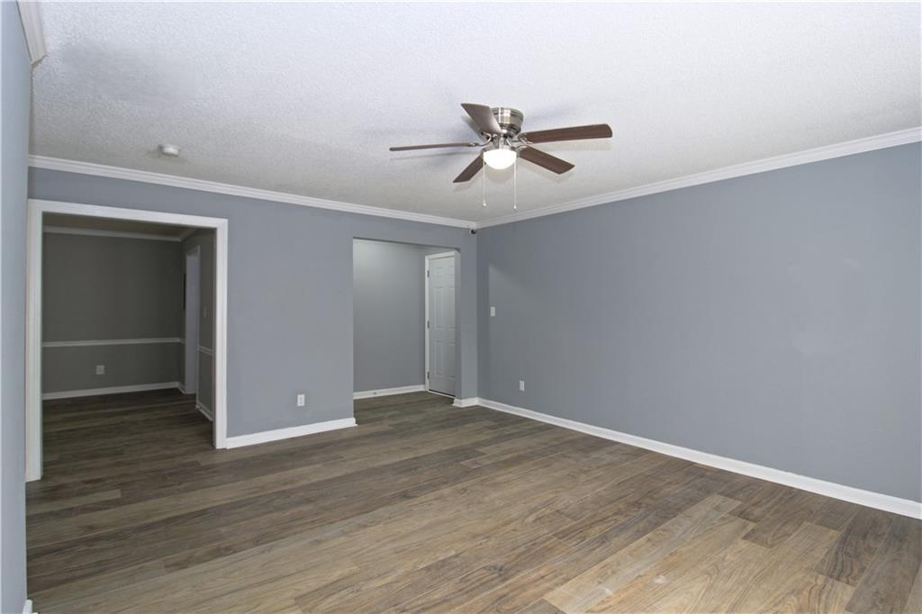 122 Rue Fontaine Lithonia, GA 30038 - Photo 4 of 36 a view of empty room with wooden floor