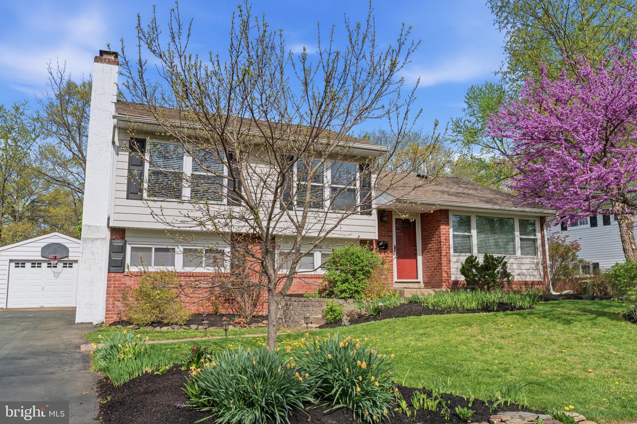 front view of a house with a garden