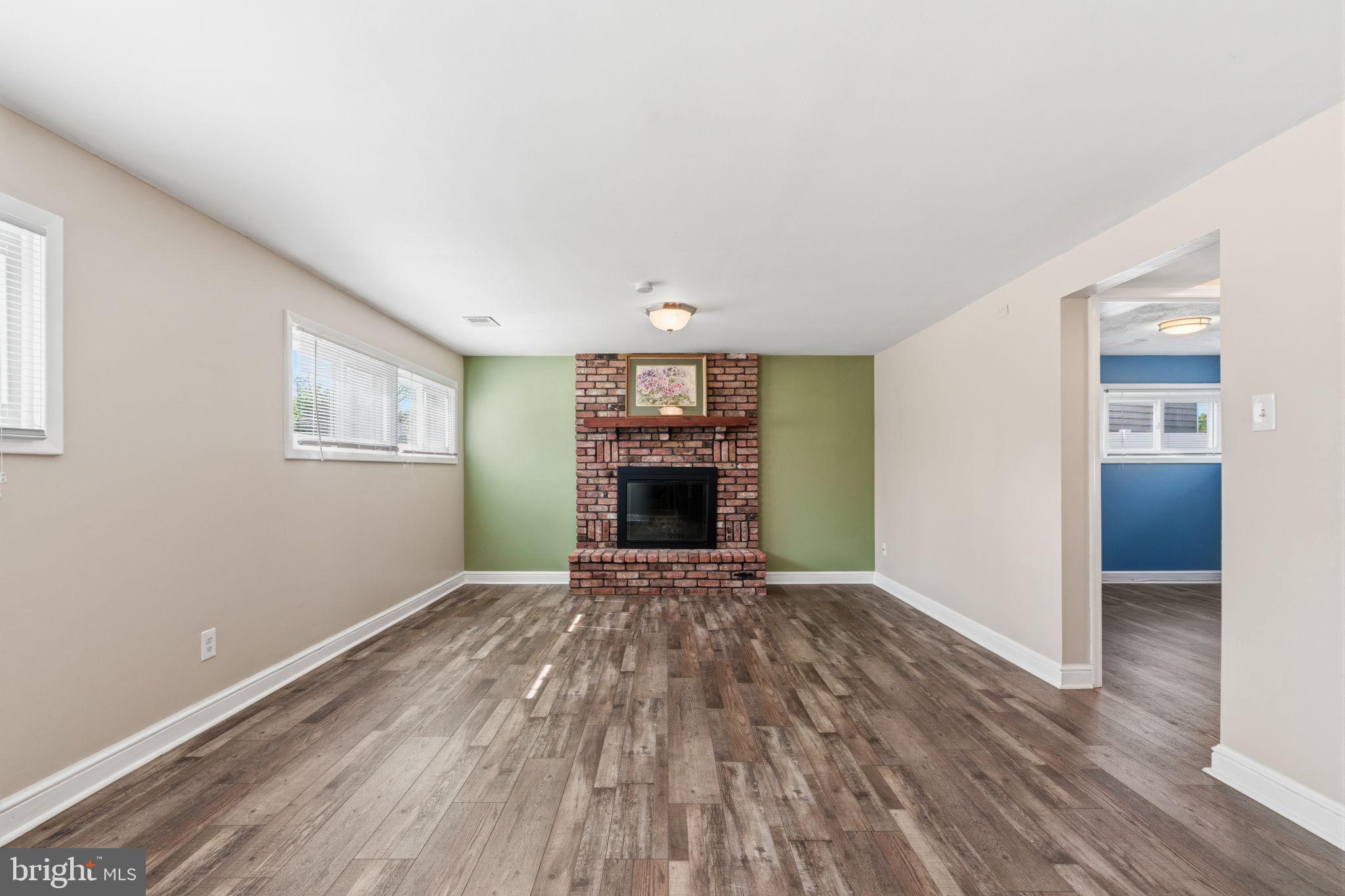 502 Stevens Road Morrisville, PA 19067 - Photo 17 of 37 a view of an empty room with a window and fireplace