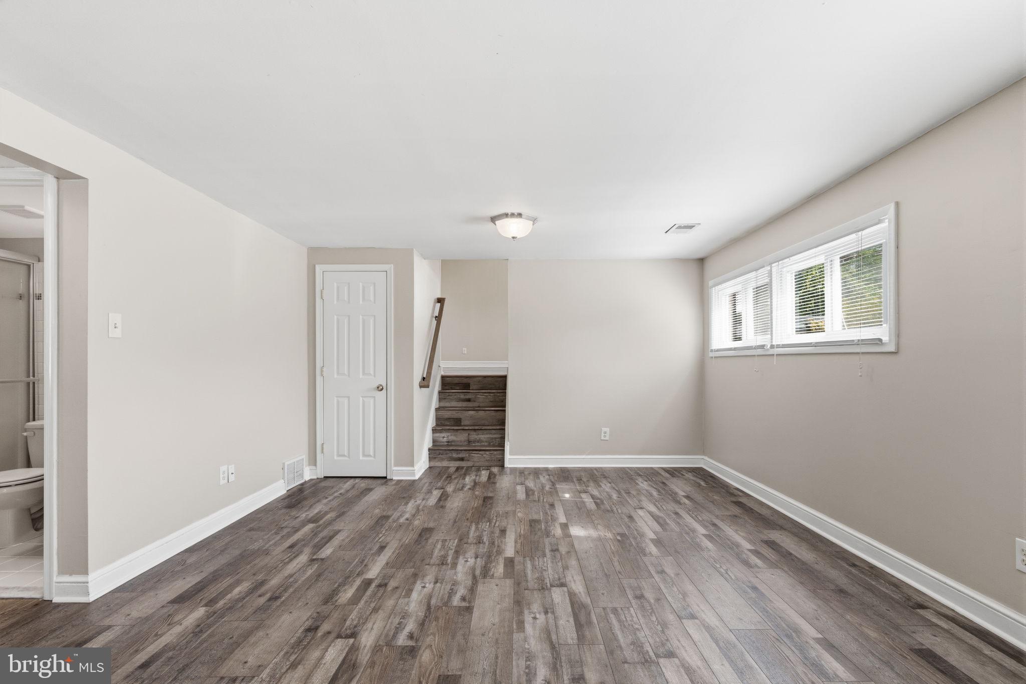 502 Stevens Road Morrisville, PA 19067 - Photo 18 of 37 a view of a room with wooden floor and a window