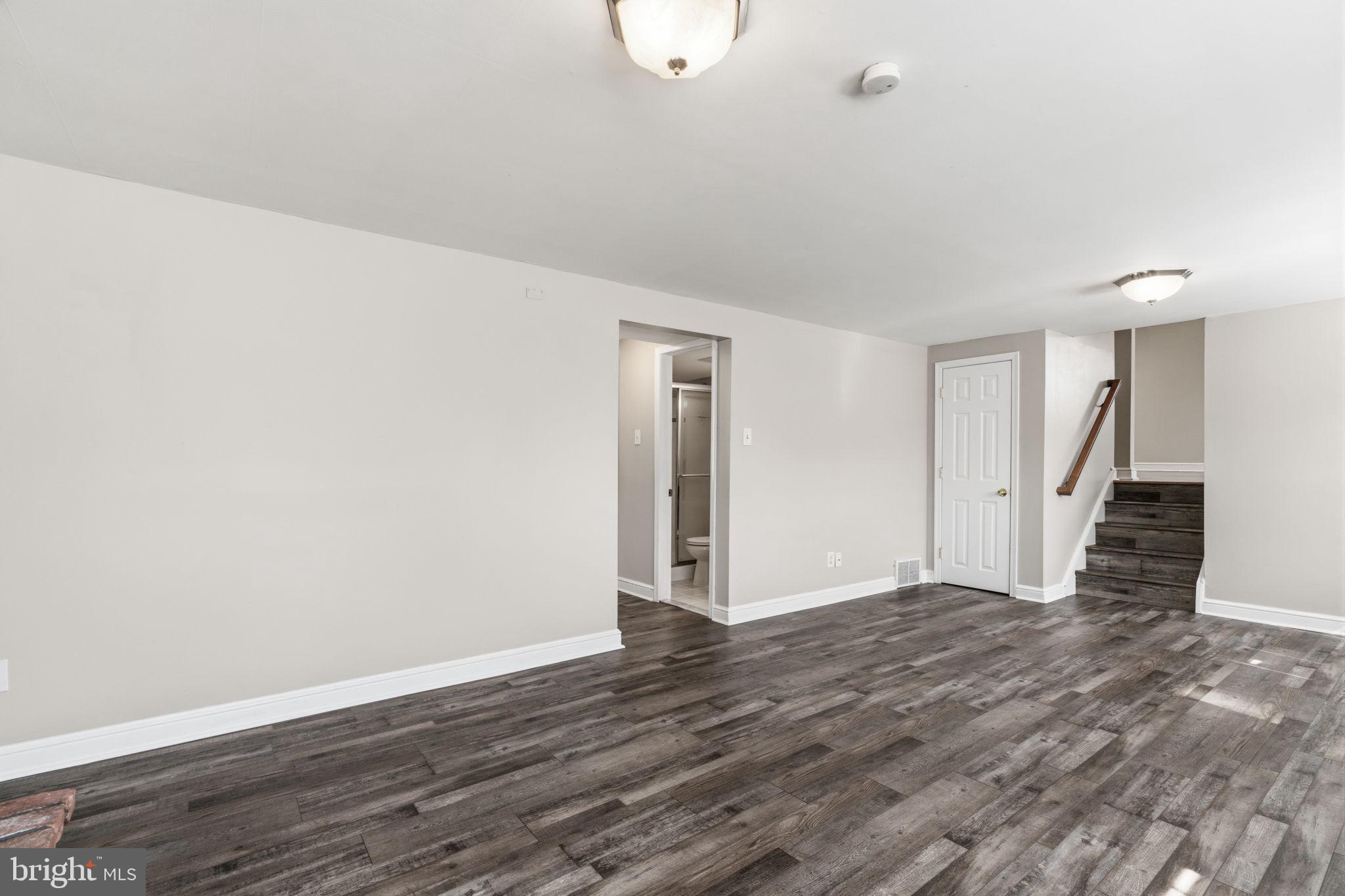 502 Stevens Road Morrisville, PA 19067 - Photo 19 of 37 a view of an empty room with wooden floor and a window