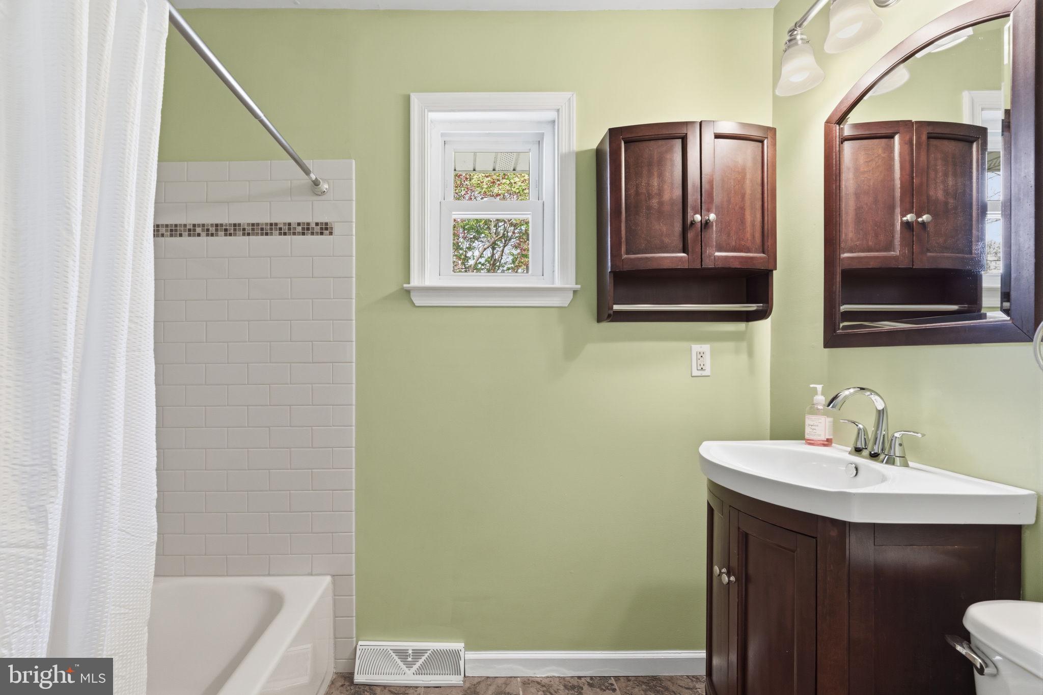 502 Stevens Road Morrisville, PA 19067 - Photo 23 of 37 a bathroom with a sink and a mirror