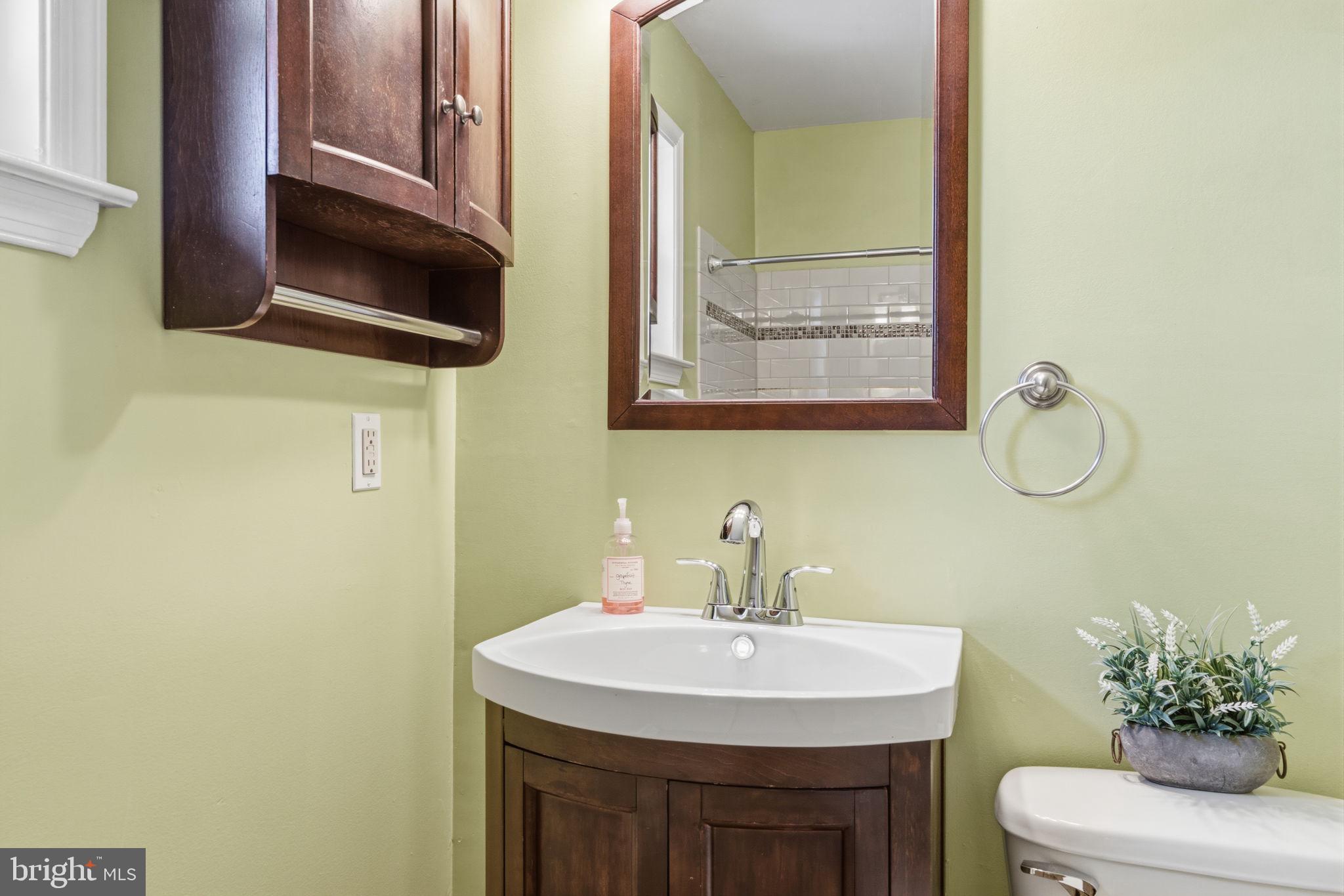 502 Stevens Road Morrisville, PA 19067 - Photo 24 of 37 a bathroom with a sink and a mirror