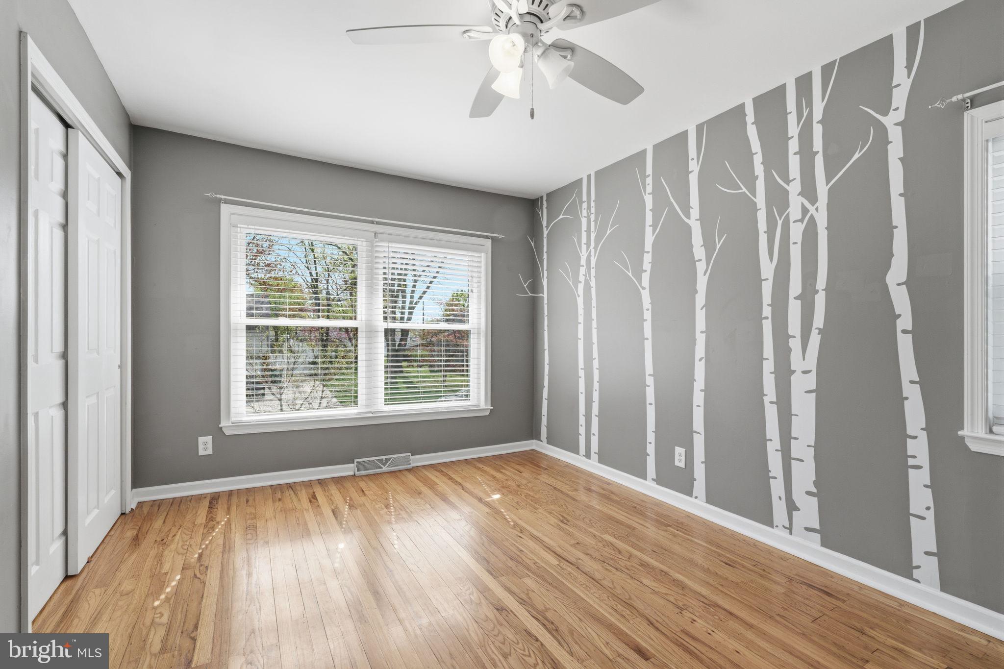 502 Stevens Road Morrisville, PA 19067 - Photo 27 of 37 a view of an empty room with wooden floor and a window