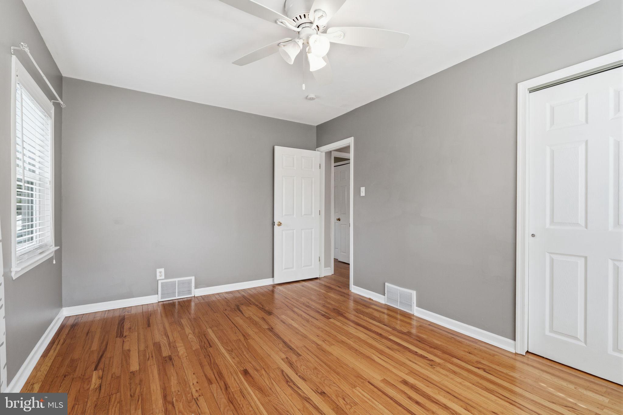 502 Stevens Road Morrisville, PA 19067 - Photo 28 of 37 a view of an empty room with wooden floor