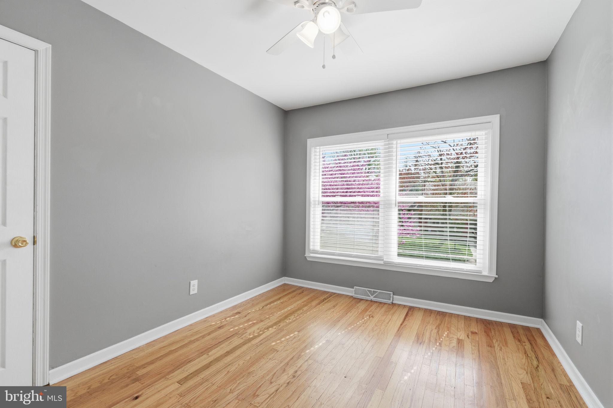 502 Stevens Road Morrisville, PA 19067 - Photo 29 of 37 a view of an empty room with wooden floor and a window