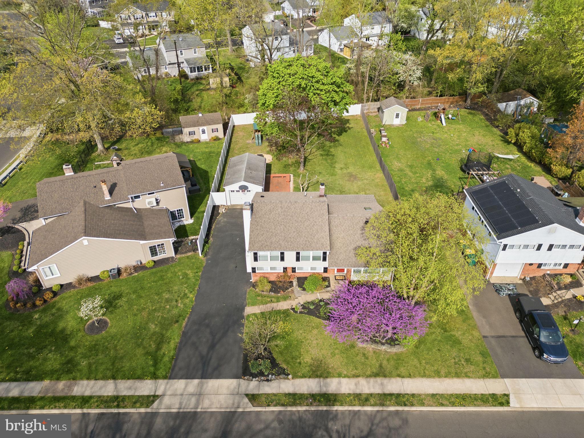 502 Stevens Road Morrisville, PA 19067 - Photo 34 of 37 an aerial view of a house with a yard and trees