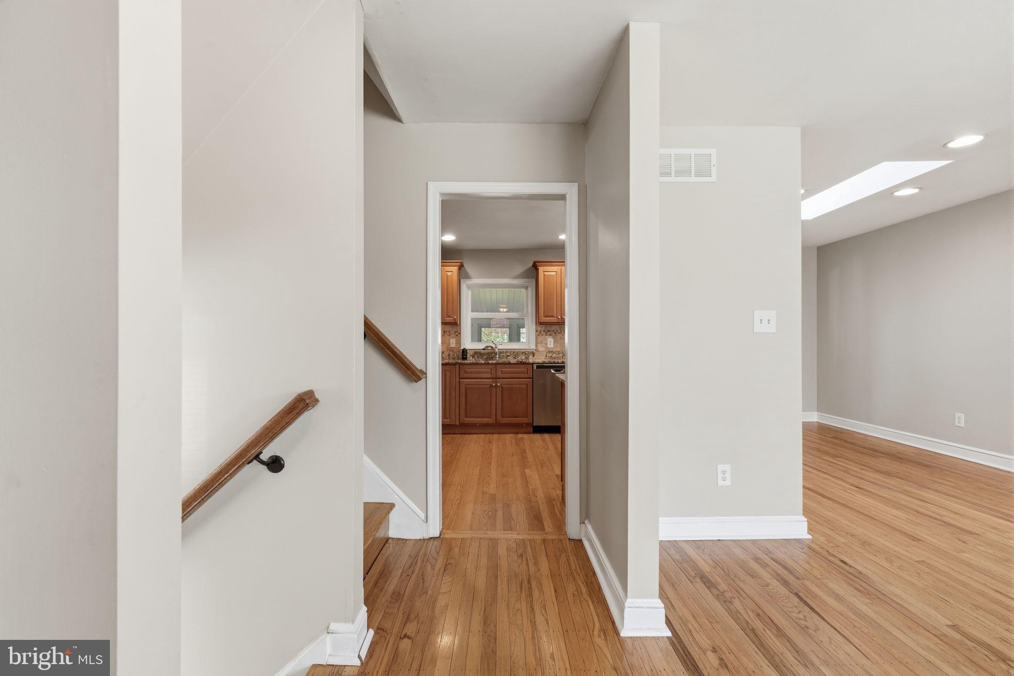 502 Stevens Road Morrisville, PA 19067 - Photo 5 of 37 a view of a hallway view with wooden floor and staircase