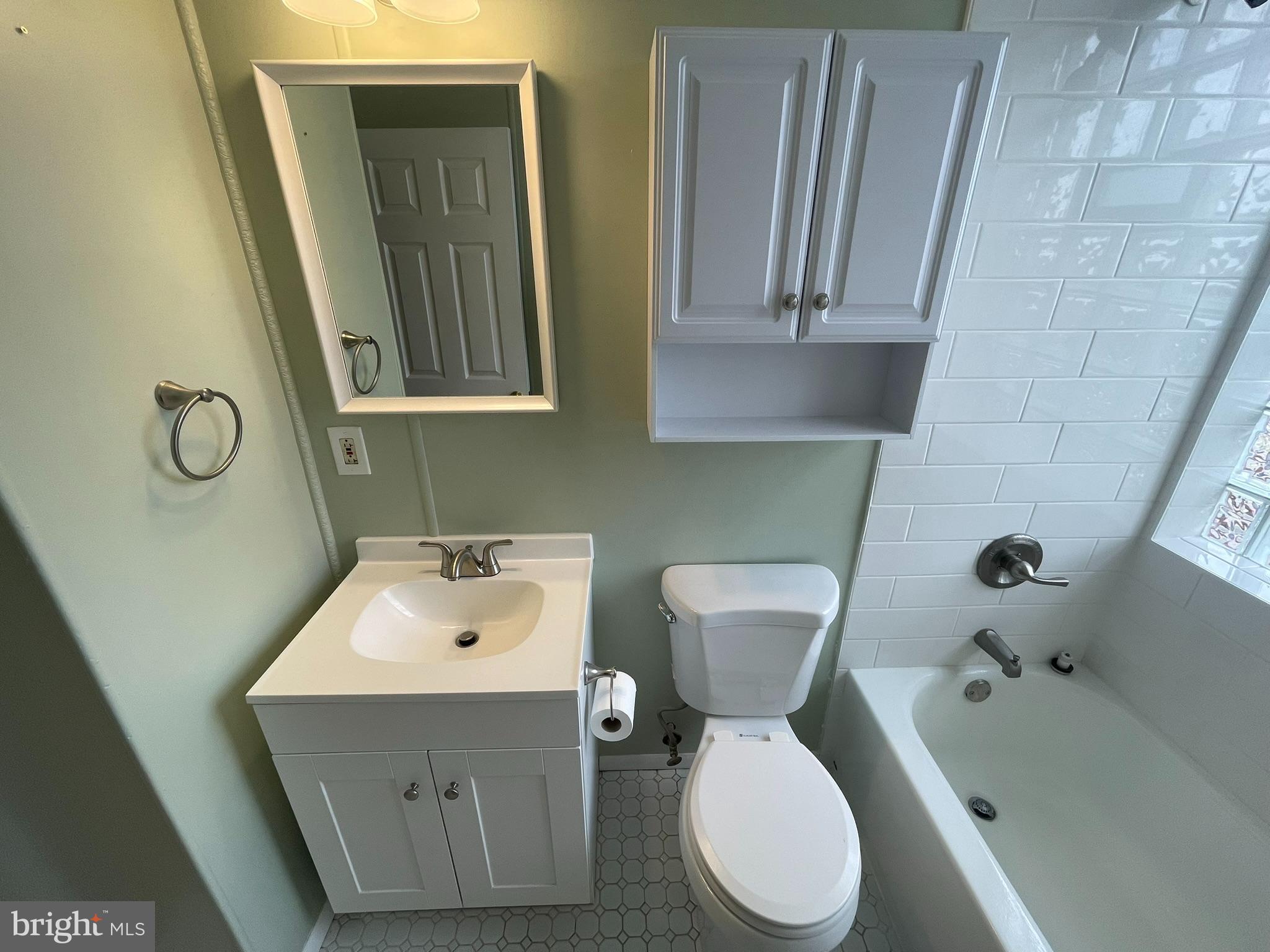 8134 Gray Haven Road Baltimore, MD 21222 - Photo 13 of 30 a bathroom with a toilet sink and mirror