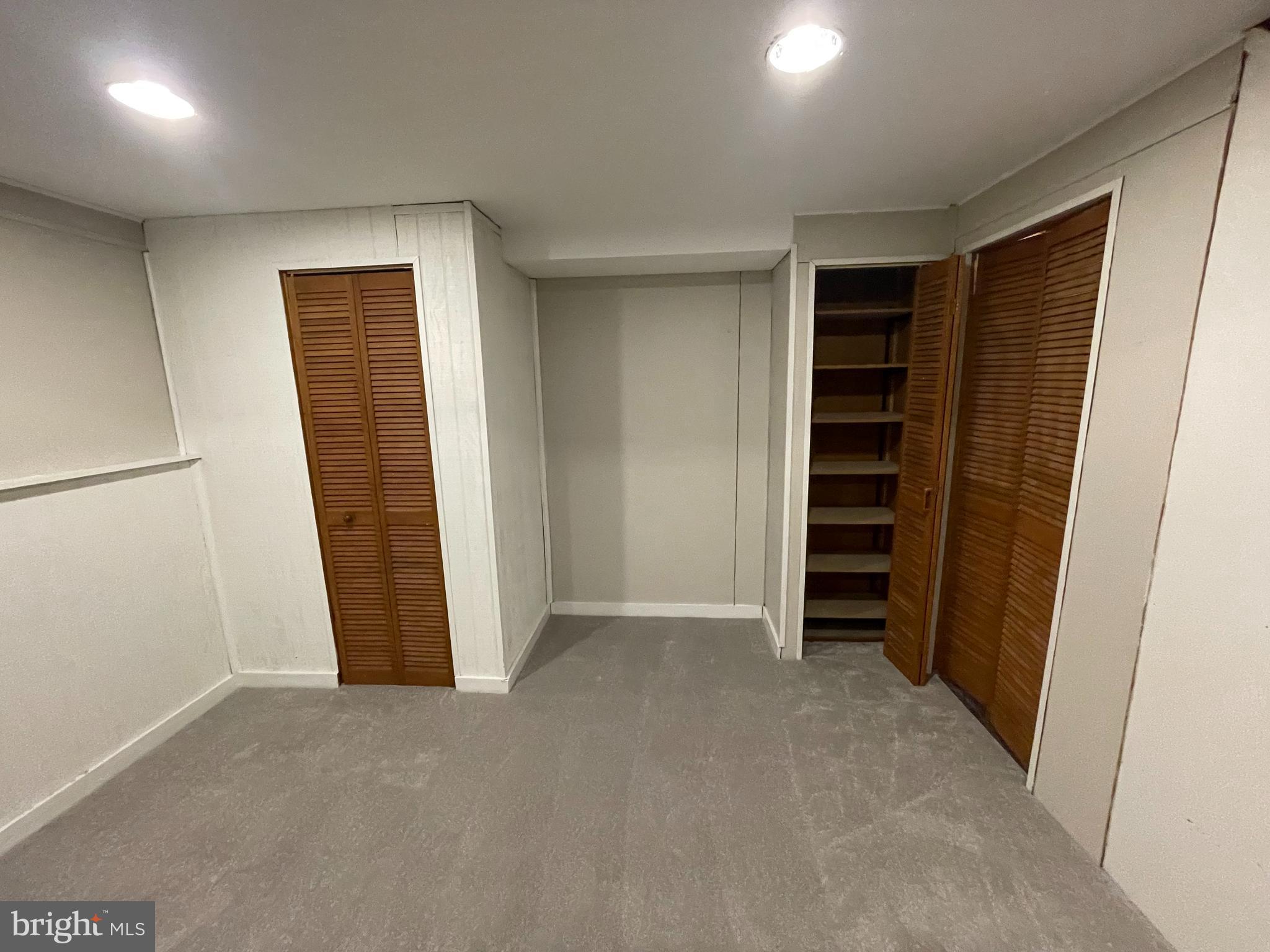 8134 Gray Haven Road Baltimore, MD 21222 - Photo 28 of 30 an empty room with closet and empty shelves