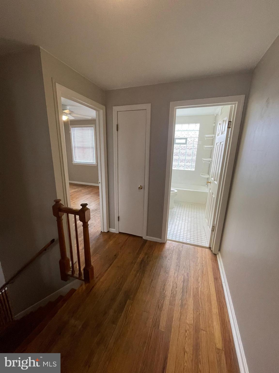 8134 Gray Haven Road Baltimore, MD 21222 - Photo 10 of 30 a view of a livingroom with wooden floor and chair