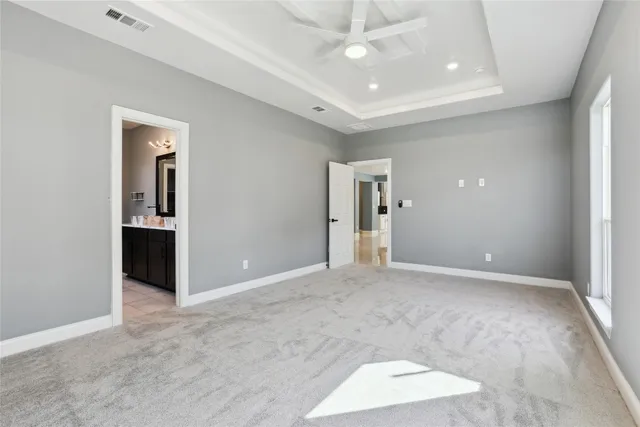 a bathroom with a granite countertop sink a toilet and shower