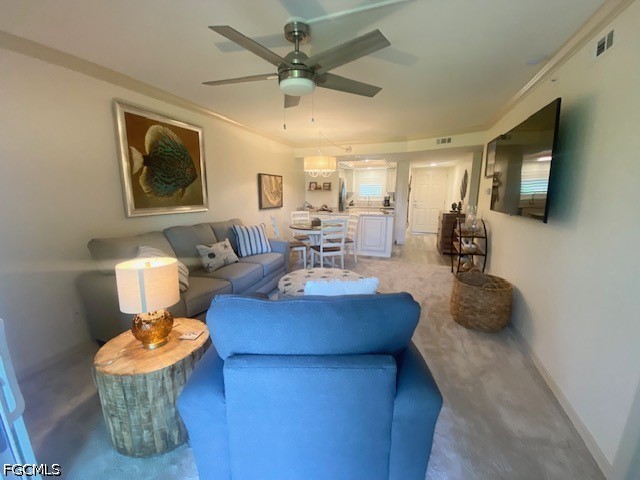 16007 Davis Road, Unit 614 Fort Myers, FL 33908 - Photo 6 of 18 a living room with furniture and a flat screen tv