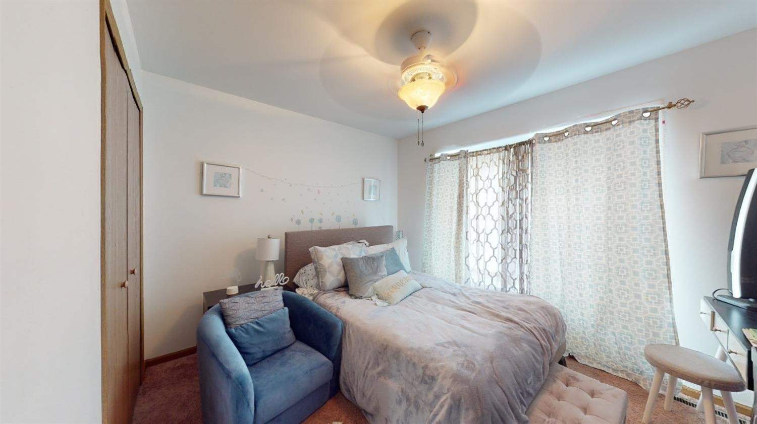 8602 Harrison Street Merrillville, IN 46410 - Photo 13 of 18 a bedroom with a bed and a chandelier