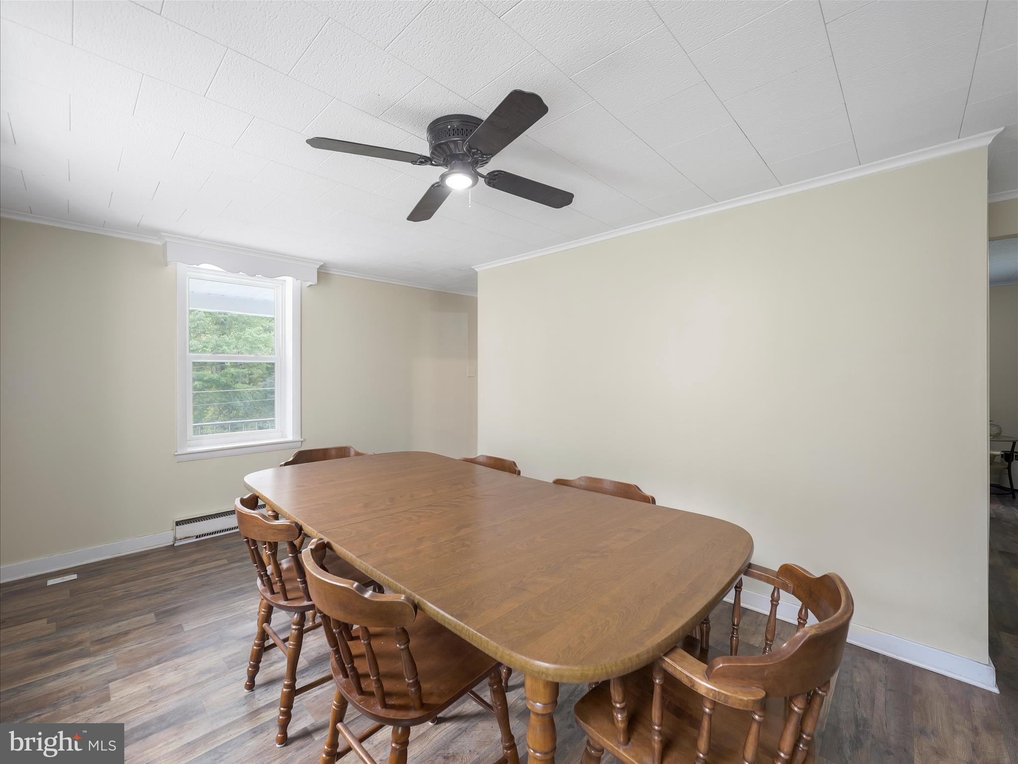 2550 Iron Springs Road Fairfield, PA 17320 - Photo 14 of 32 a view of a dining room with furniture and wooden floor