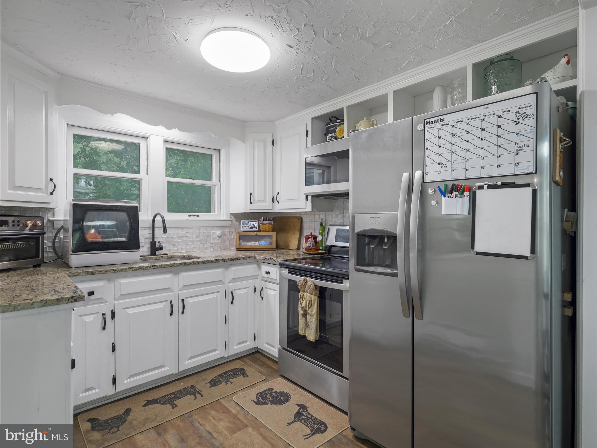 2550 Iron Springs Road Fairfield, PA 17320 - Photo 5 of 32 a kitchen with stainless steel appliances granite countertop a refrigerator sink and stove