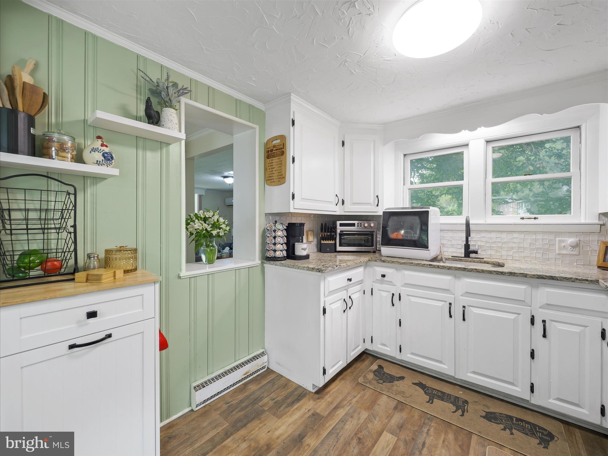 2550 Iron Springs Road Fairfield, PA 17320 - Photo 6 of 32 a kitchen with stainless steel appliances white cabinets a sink and a window
