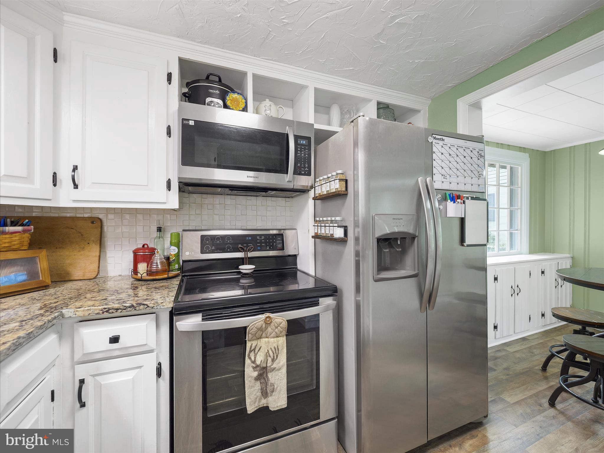 2550 Iron Springs Road Fairfield, PA 17320 - Photo 7 of 32 a kitchen with stainless steel appliances granite countertop a refrigerator a stove and a sink