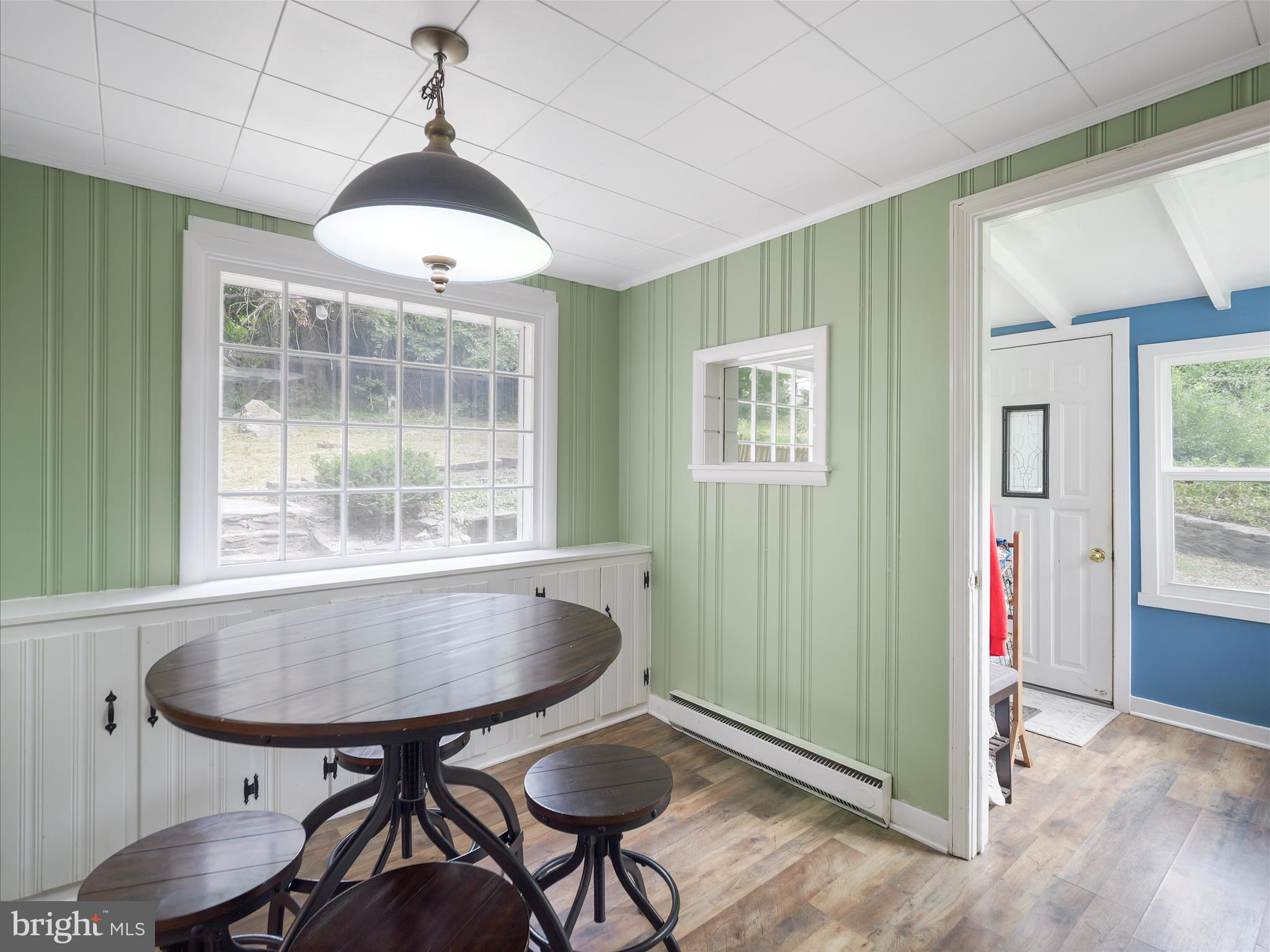 2550 Iron Springs Road Fairfield, PA 17320 - Photo 9 of 32 a view of a dining room with furniture window and wooden floor