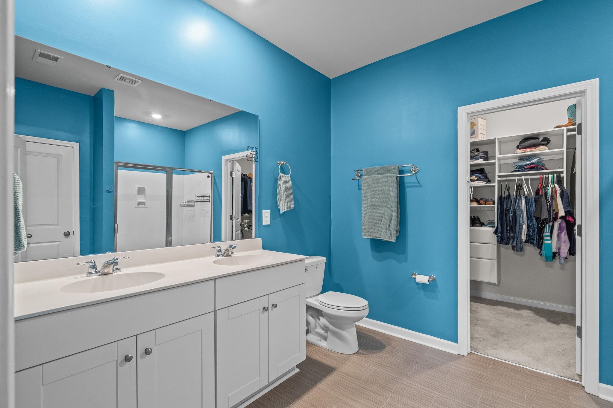 201 Craigflower Court Longs, SC 29568 - Photo 16 of 35 Full bathroom with a spacious closet, a stall shower, and double vanity