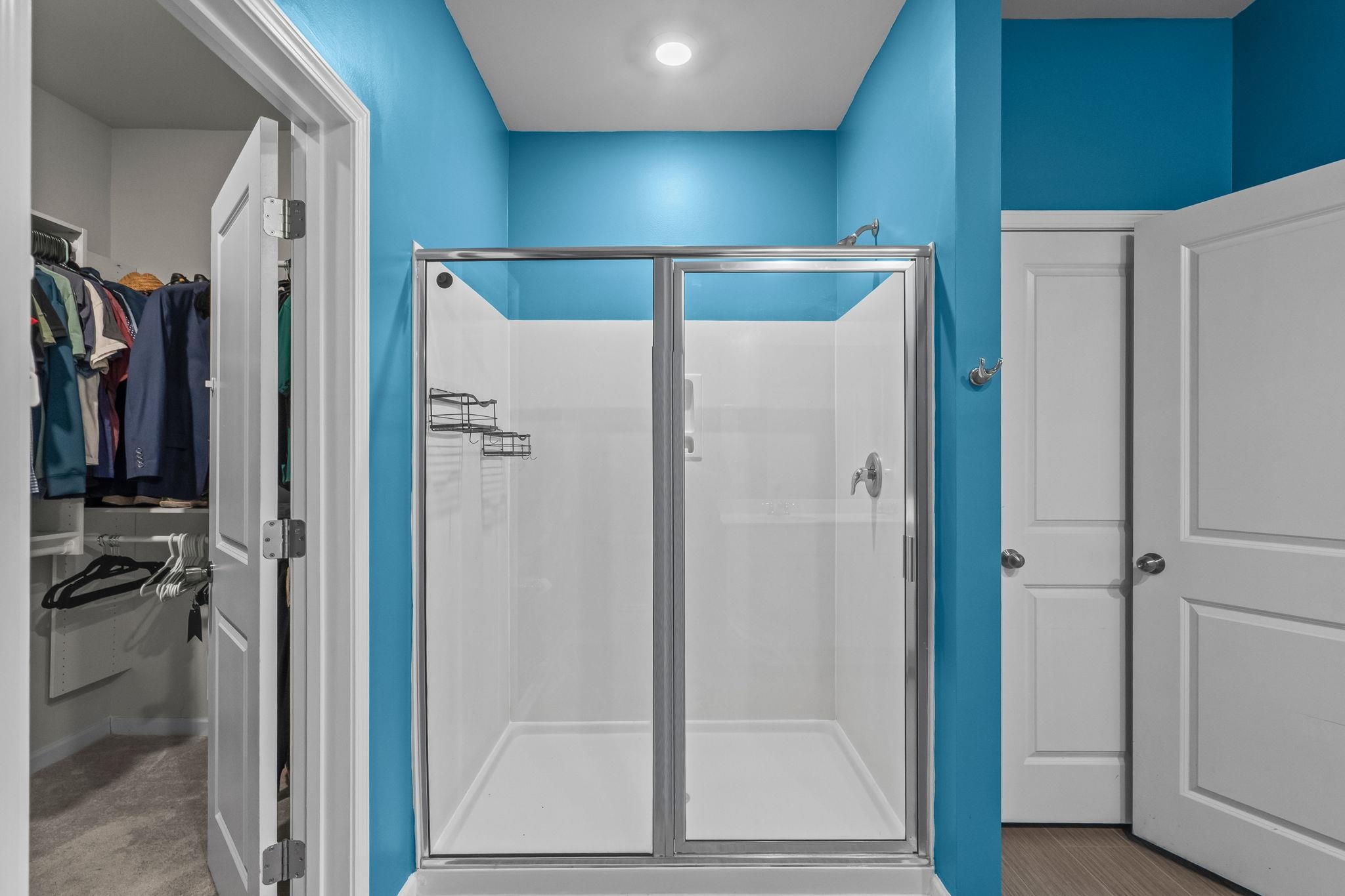 201 Craigflower Court Longs, SC 29568 - Photo 17 of 35 Full bath with a stall shower, a spacious closet, and carpet