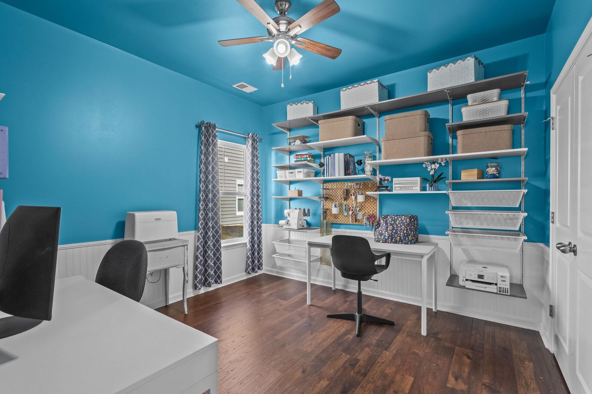 201 Craigflower Court Longs, SC 29568 - Photo 20 of 35 Home office featuring wainscoting, dark wood finished floors, and a ceiling fan