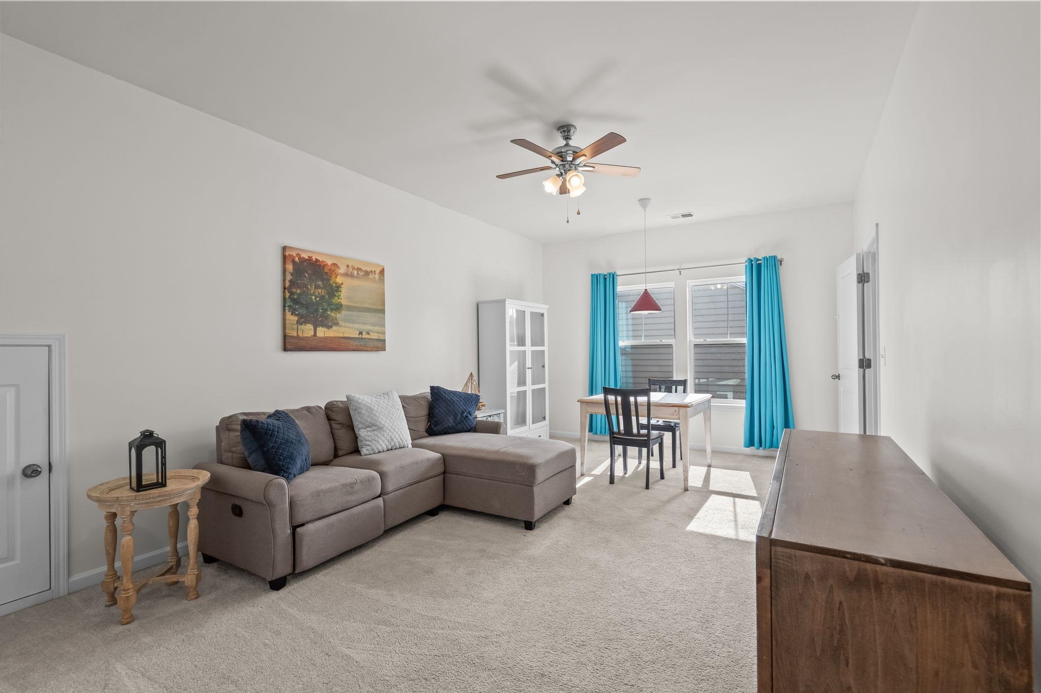 201 Craigflower Court Longs, SC 29568 - Photo 23 of 35 Living area with light colored carpet and ceiling fan