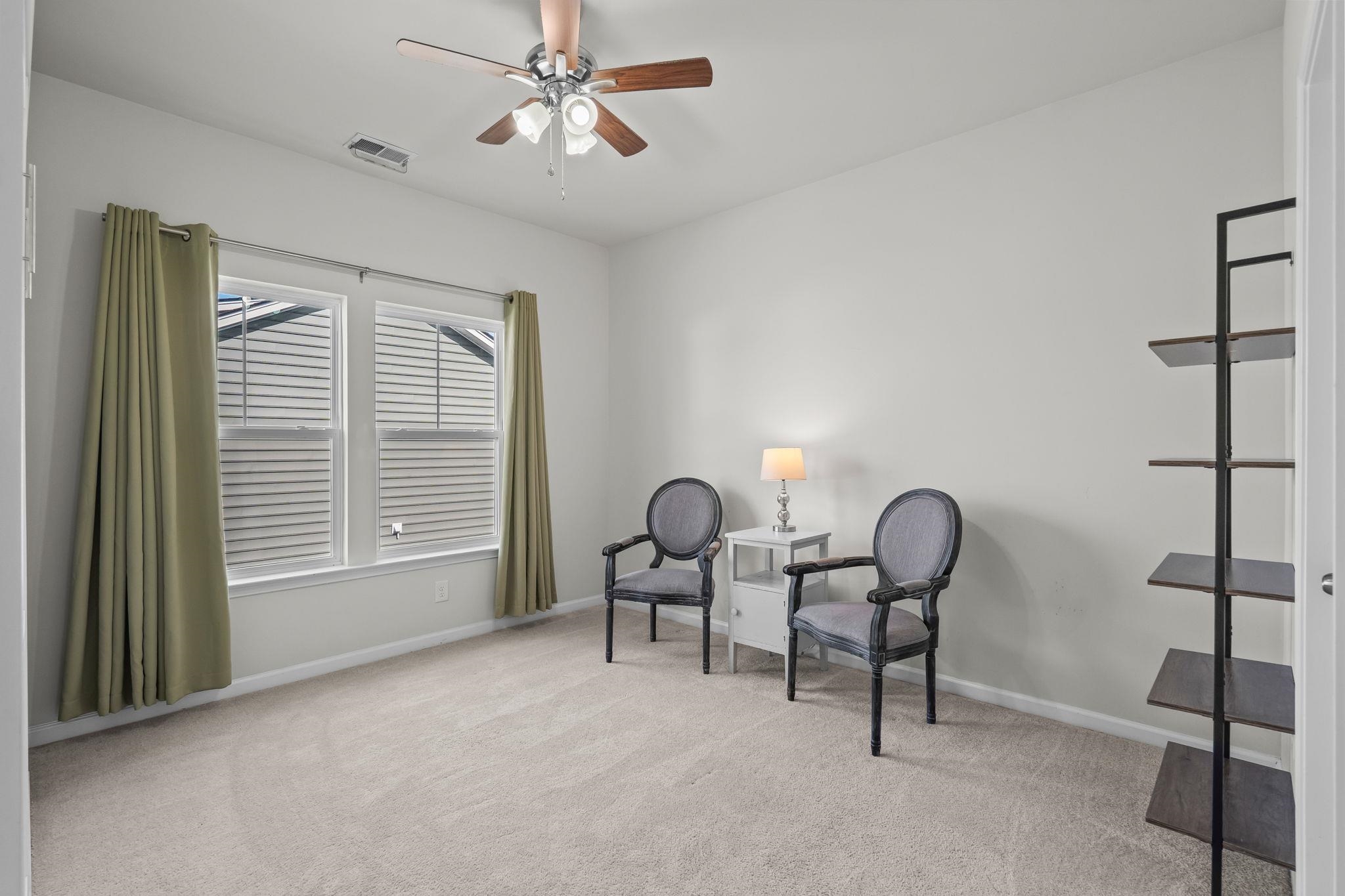201 Craigflower Court Longs, SC 29568 - Photo 26 of 35 Living area with light colored carpet and a ceiling fan