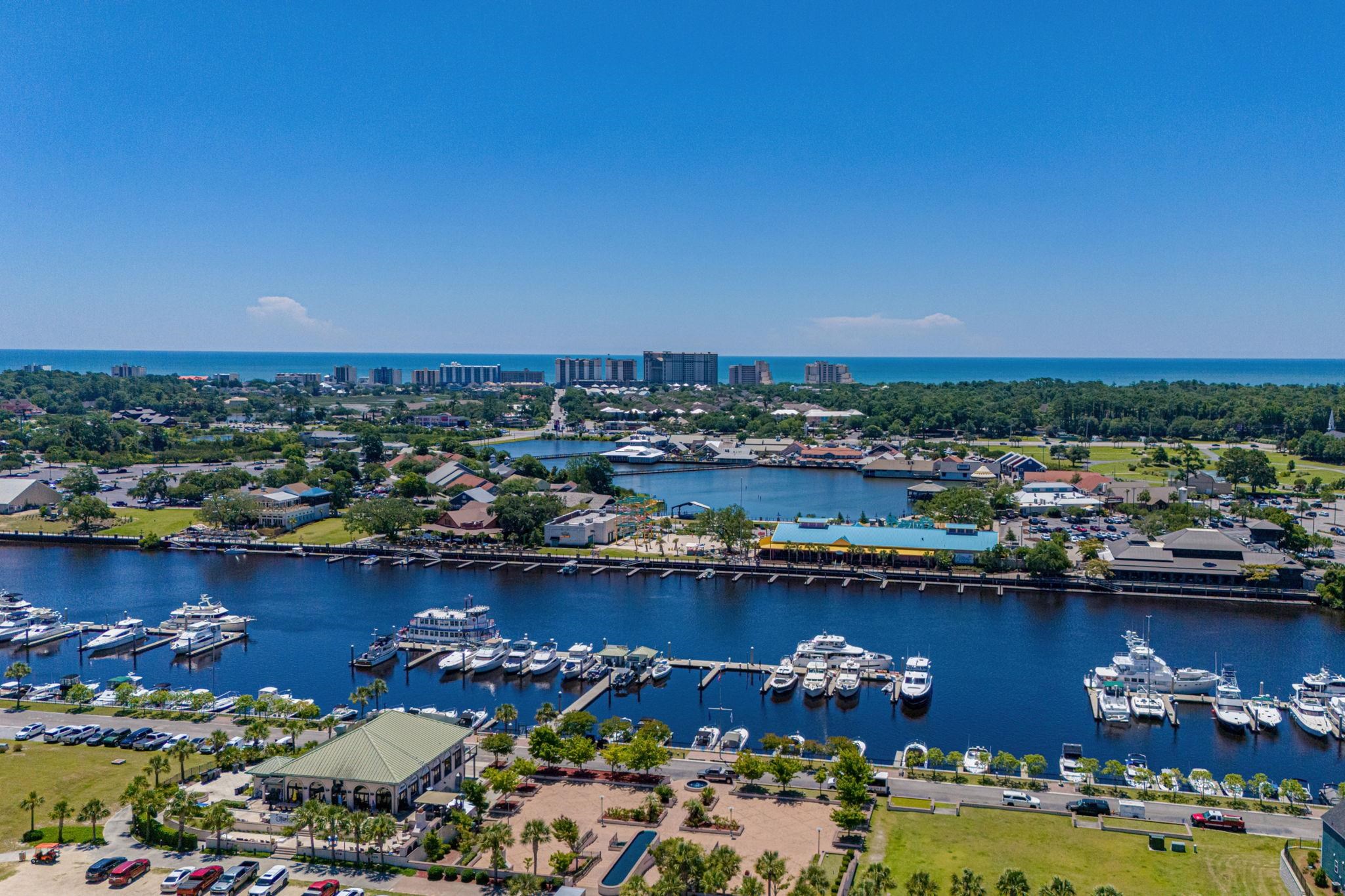 201 Craigflower Court Longs, SC 29568 - Photo 33 of 35 Drone / aerial view of a large body of water and a marina