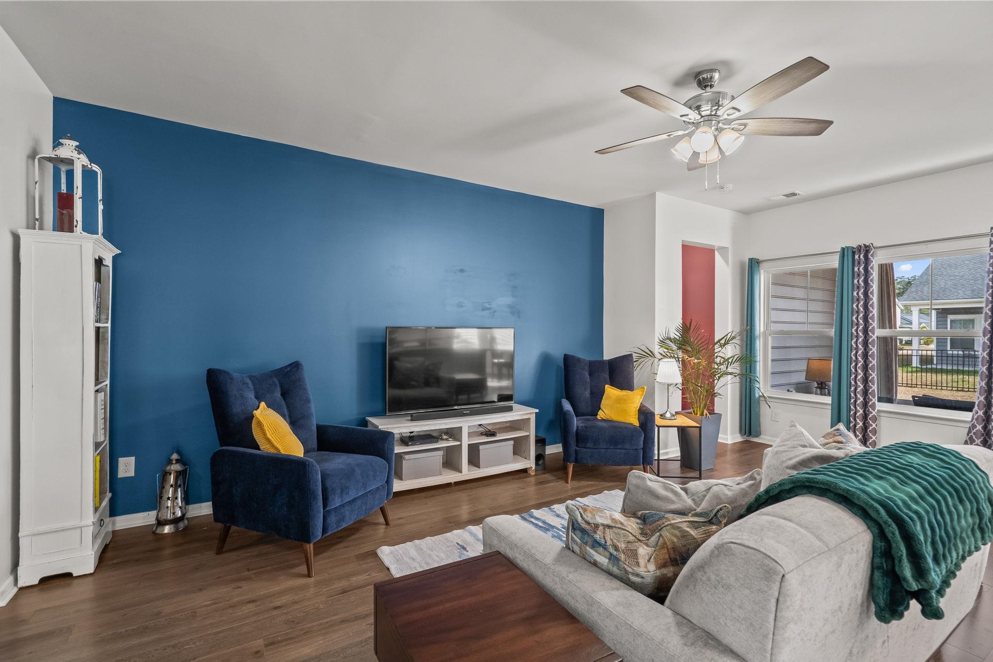 201 Craigflower Court Longs, SC 29568 - Photo 6 of 35 Living area featuring dark wood-style floors and ceiling fan