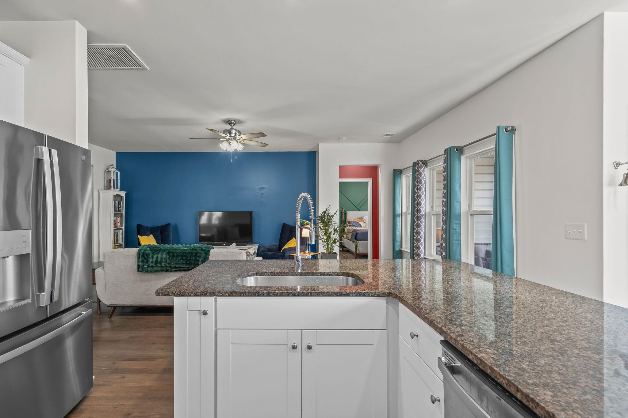 201 Craigflower Court Longs, SC 29568 - Photo 35 of 35 Kitchen with appliances with stainless steel finishes, white cabinets, dark stone countertops, and open floor plan