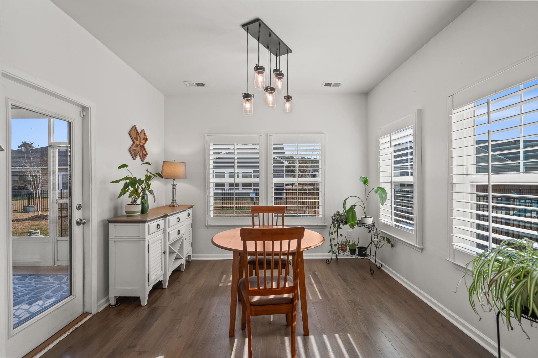 201 Craigflower Court Longs, SC 29568 - Photo 9 of 35 Dining room with dark wood-style flooring and baseboards