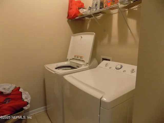 a bedroom with a bed and a chair