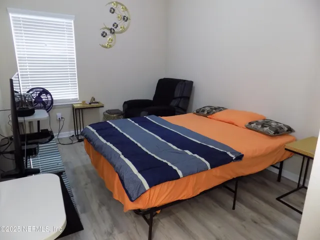 a view of backyard with tub