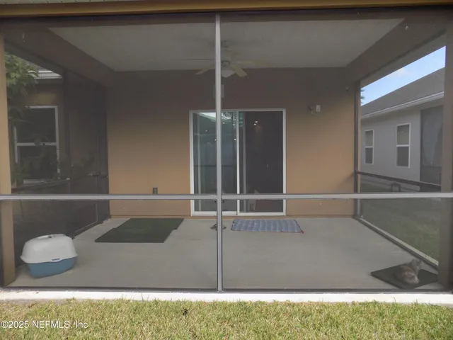 a front view of a house with a yard garage and fountain