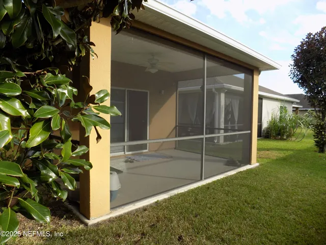a house that has a tree in front of it