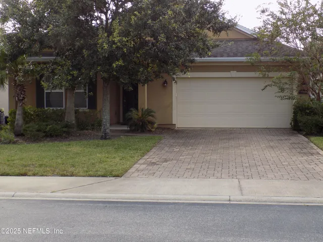 a backyard of a house with lots of green space